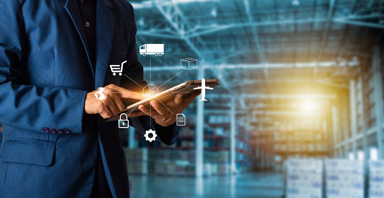 Inventory Management - Man in Warehouse on Tablet with Digital Icons